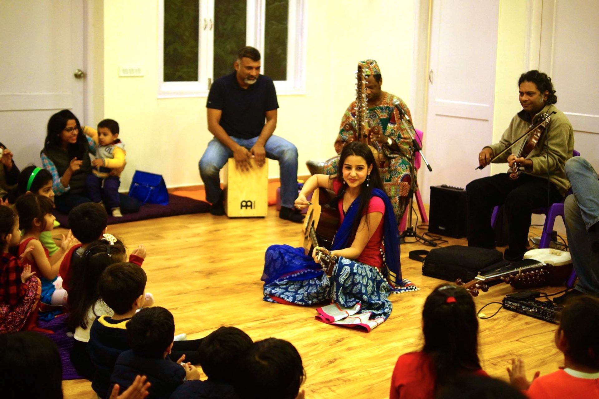 Children participating in a music workshop in JLT, Dubai with instruments and movement activities