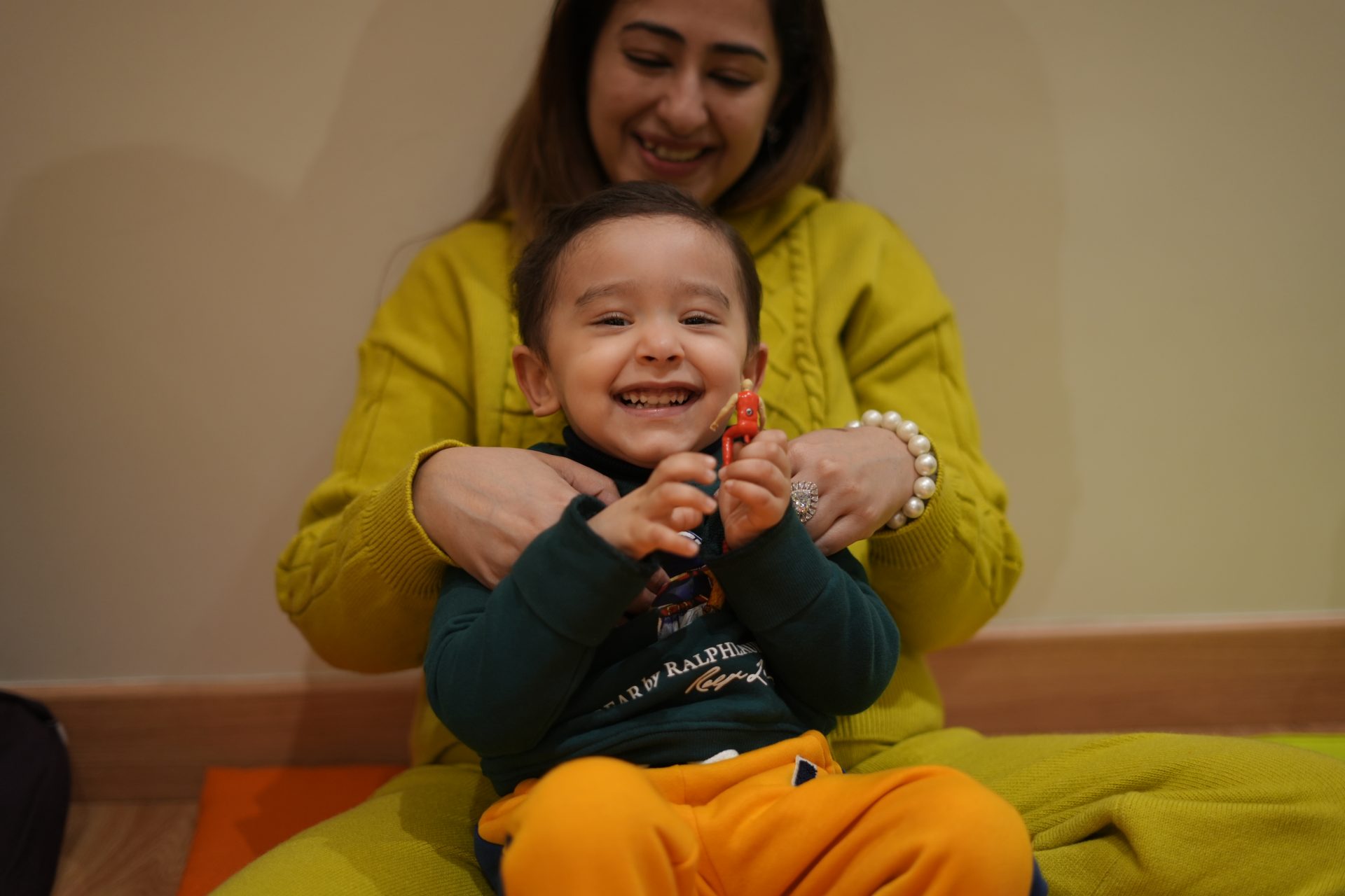 Children participating in an interactive music class with instruments in JLT Dubai
