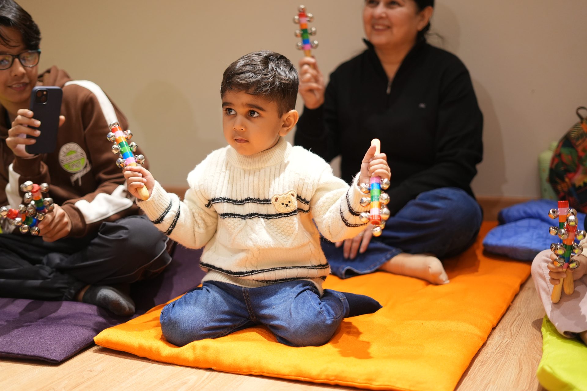 Toddlers participating in a music and movement class with instruments at MOZARTSY in JLT Dubai