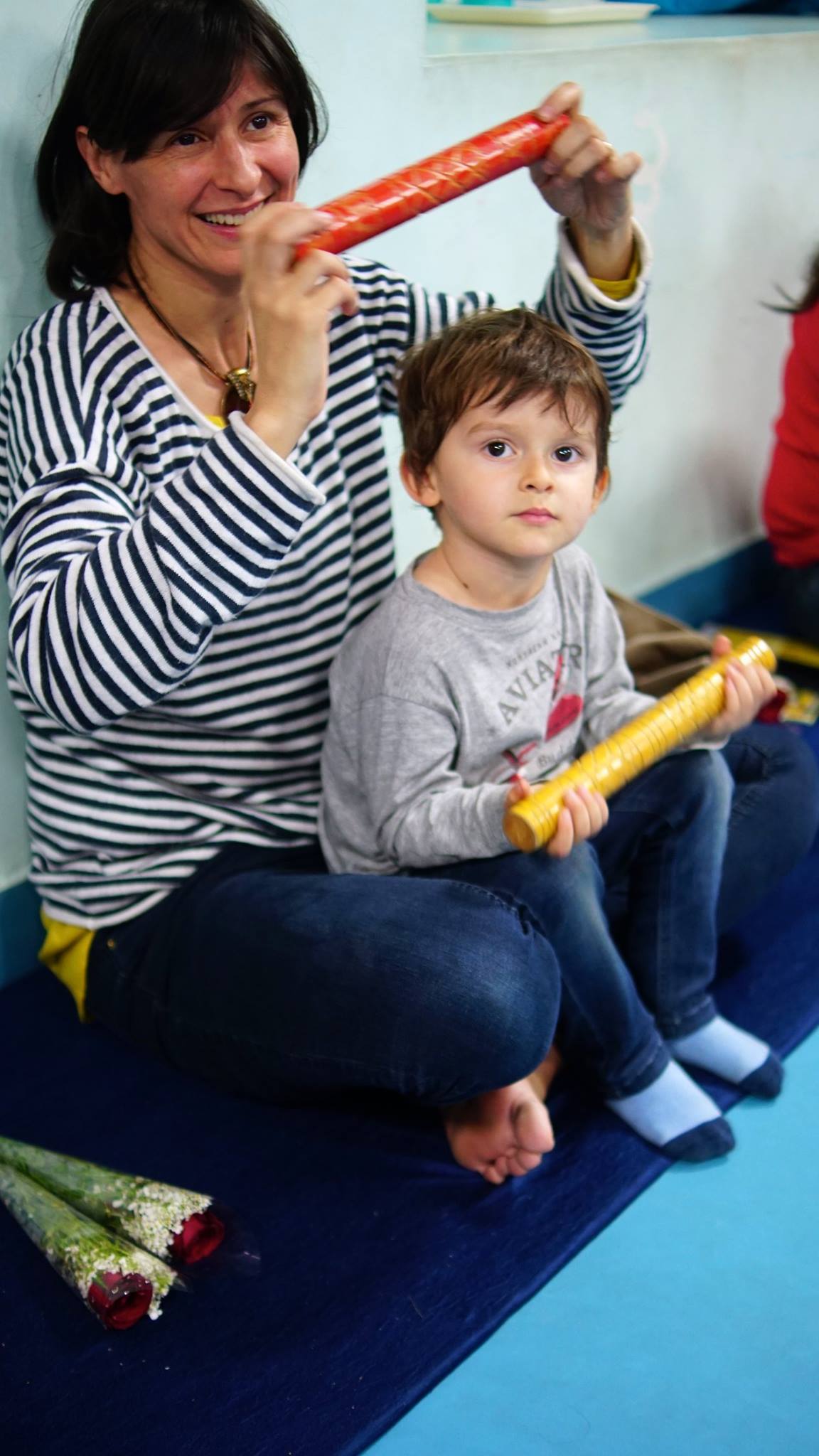 Mother and baby participating in a baby music class in Dubai with gentle instruments and sensory activities